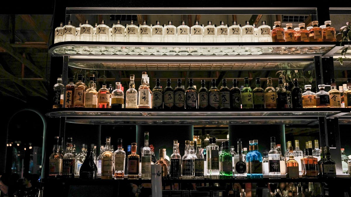 Bar shelves lined with whisky bottles